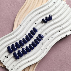 KXAMELIE nails in use while typing to show durability and everyday practicality