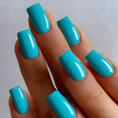 KXAMELIE close-up of glossy teal texture showing smooth finish and salon-like shine
