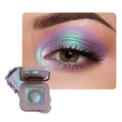 KXmzeG rose purple eyeshadow front pan showing iridescent shimmer and color payoff