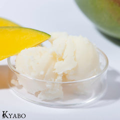 Kyabo mango butter scooped on spoon demonstrating easy melting and spreadability