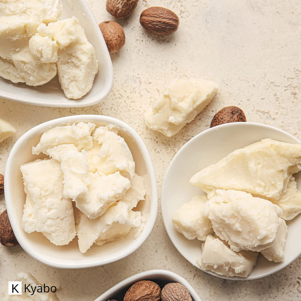 Kyabo shea butter applied to curly hair showing frizz control and softness