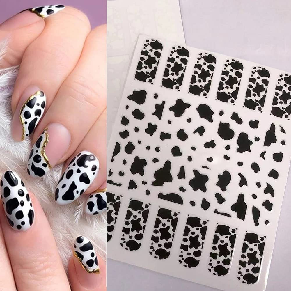 KZBTRBT stickers applied on acrylic nails demonstrating polished finished manicure