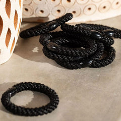 L. Erickson ponytail holder worn by runner demonstrating secure hold during activity