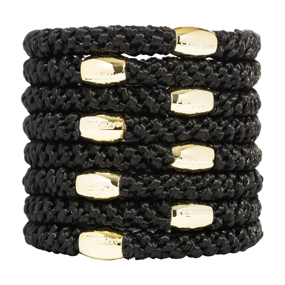 L. Erickson front packaging showing eight black ties and gold bead benefit: stylish and ready