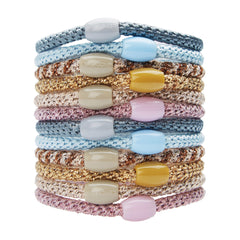 L. Erickson front packaging showing pink and blue hair ties and bead accents for quick styling