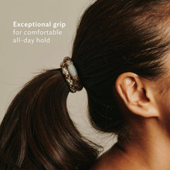 L. Erickson tied high ponytail in use demonstrating strong hold for thick hair benefit