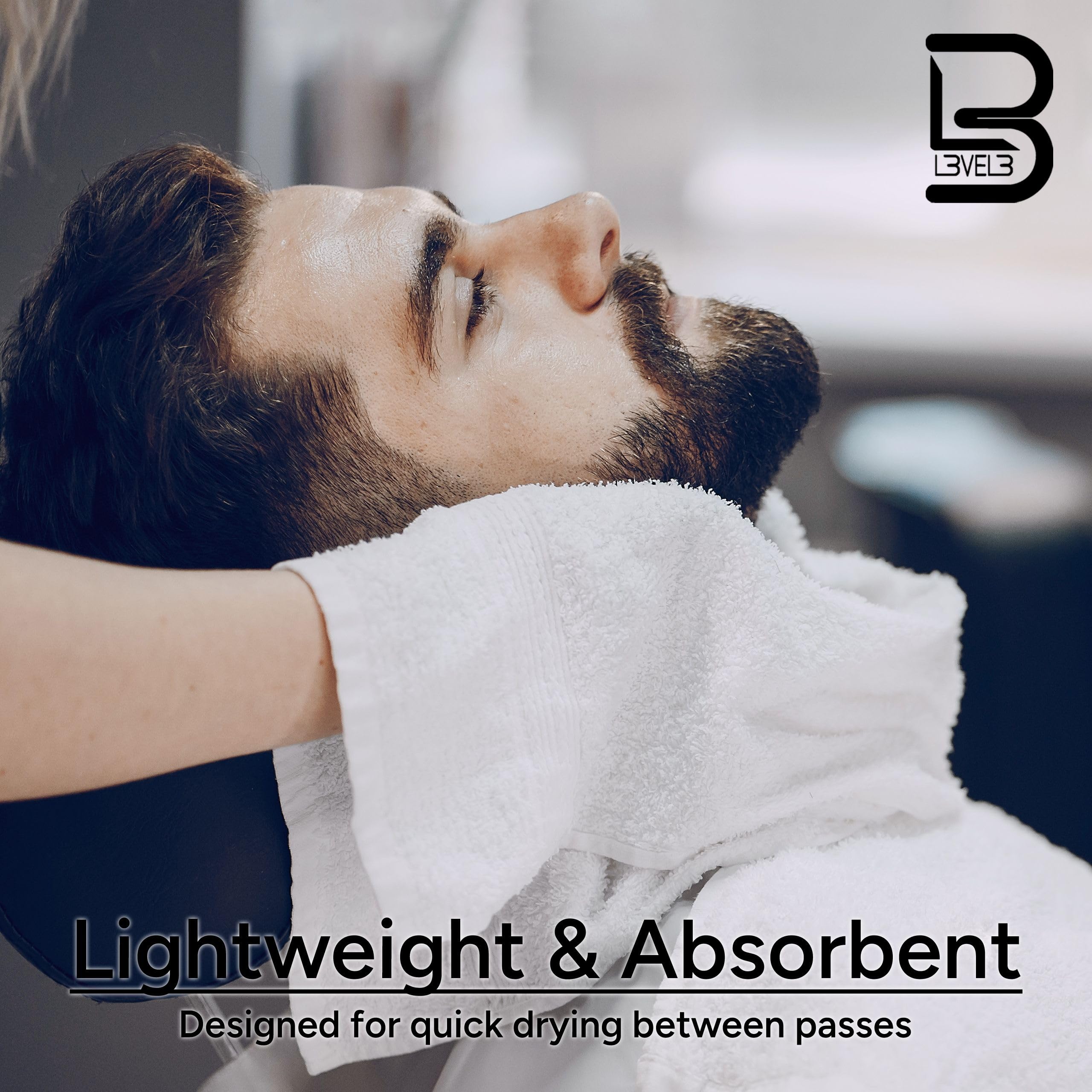 L3 towel in use by barber wiping client hair, showing quick absorbency benefit