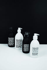 La Compagnie de Provence pouring refill into bottle showing refillable design benefit: waste reduction
