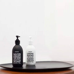 La Compagnie de Provence bottle held in hand showing scale and 16.7 fl oz size benefit: correct portioning