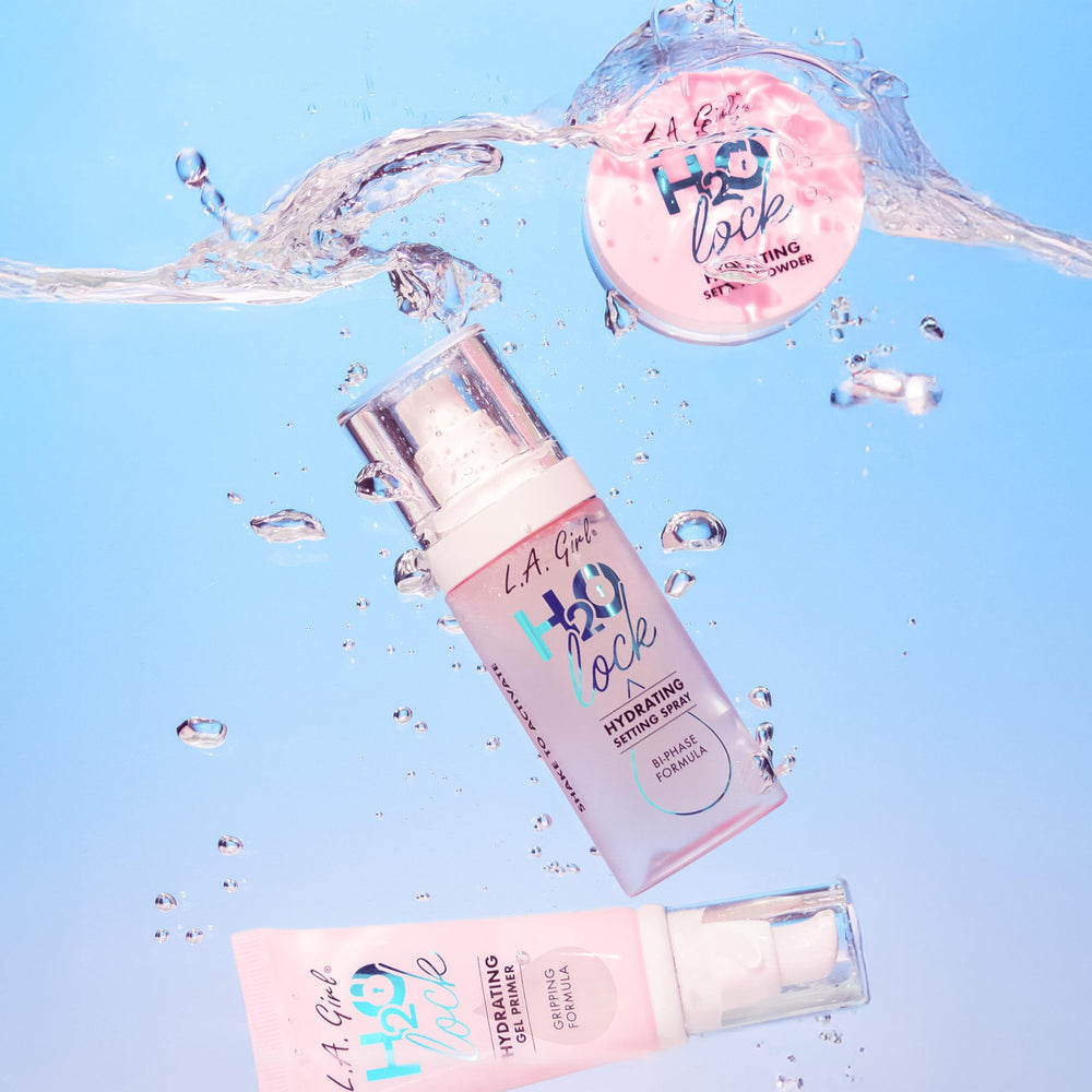 L.A. Girl flatlay with makeup collection showing finishing spray benefit