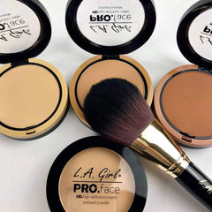 L.A. Girl compact in hand to show size and portable benefit for travel and purse
