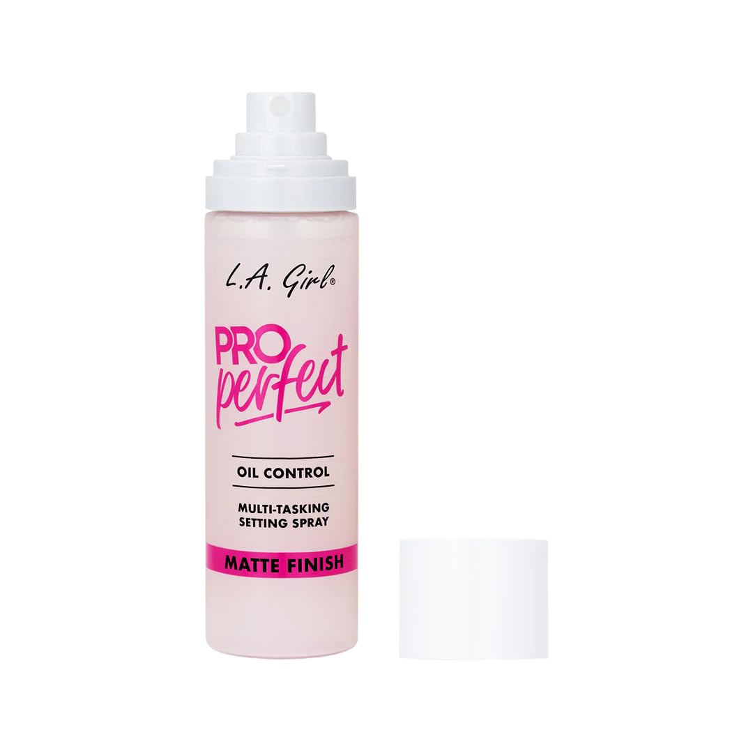 L.A. Girl bottle next to common items to show compact size and travel benefit