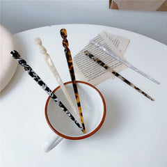 La Jolie Jasmin hair sticks staged on table showing versatile styling inspiration