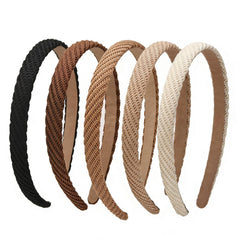 Lahnie front view of five headbands showing neutral colors and compact packaging for versatile styling