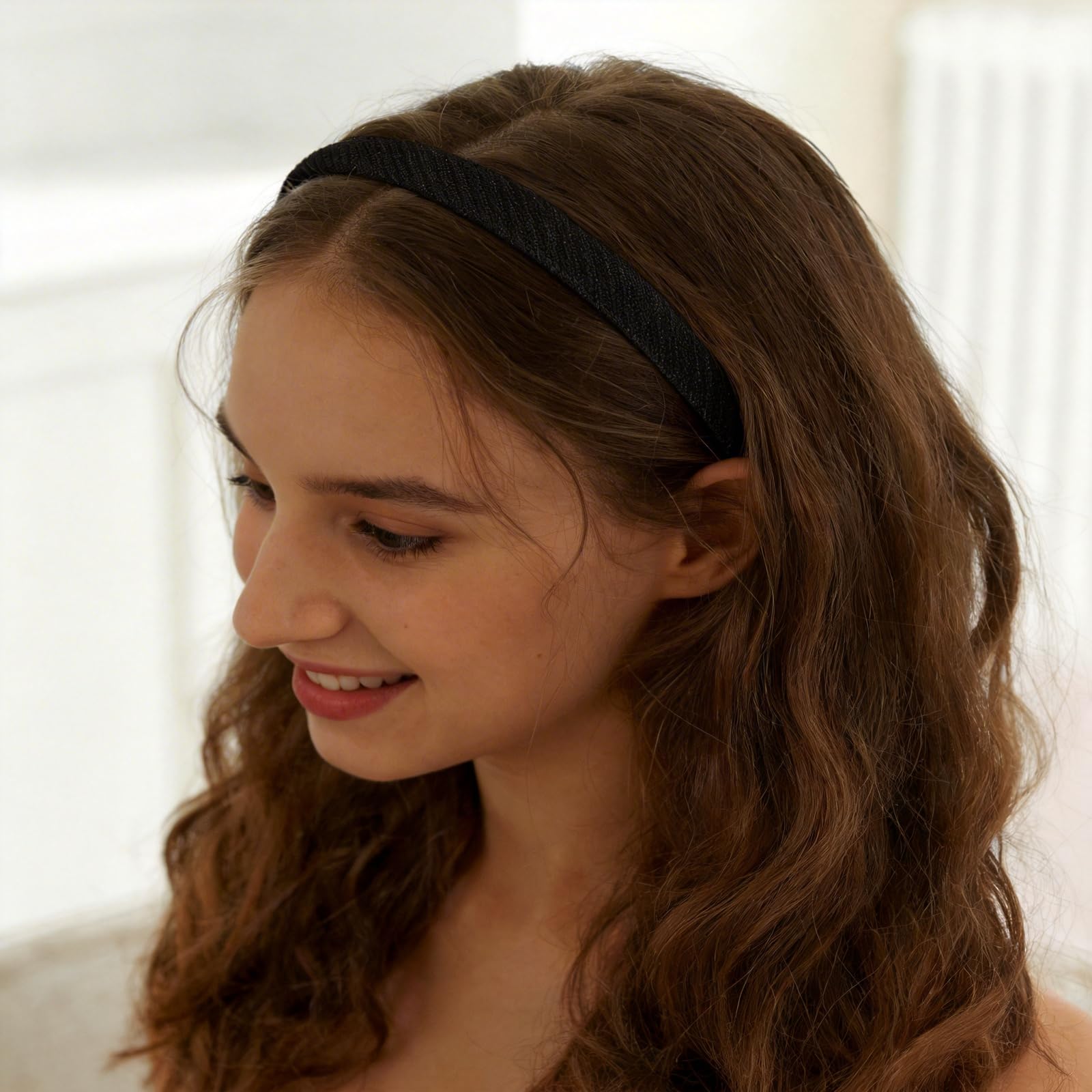 Lahnie headband styled with a bun to show gentle grip without flattening hairstyle