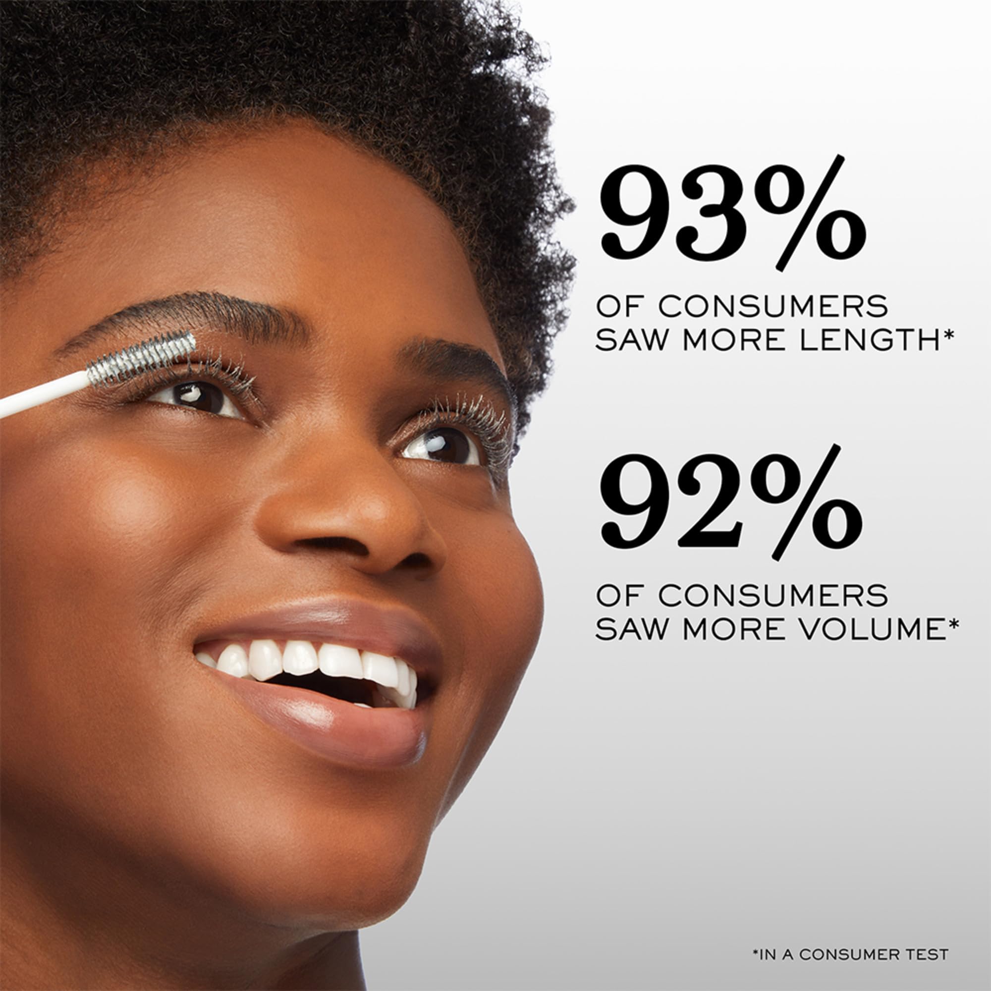 lancome cils booster xl in use while applying primer showing smoother mascara base benefit