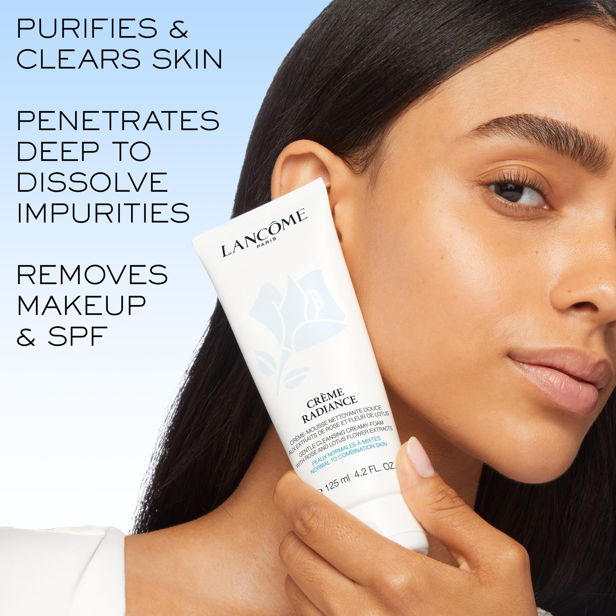 Lancôme product in hand being applied to skin demonstrating easy massage and makeup removal