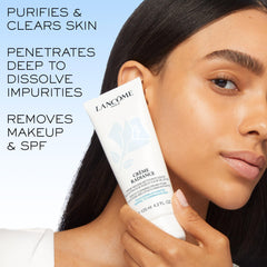 Lancôme product in hand being applied to skin demonstrating easy massage and makeup removal