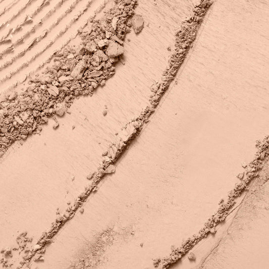 Lancôme powder close-up texture showing finely milled finish for natural look