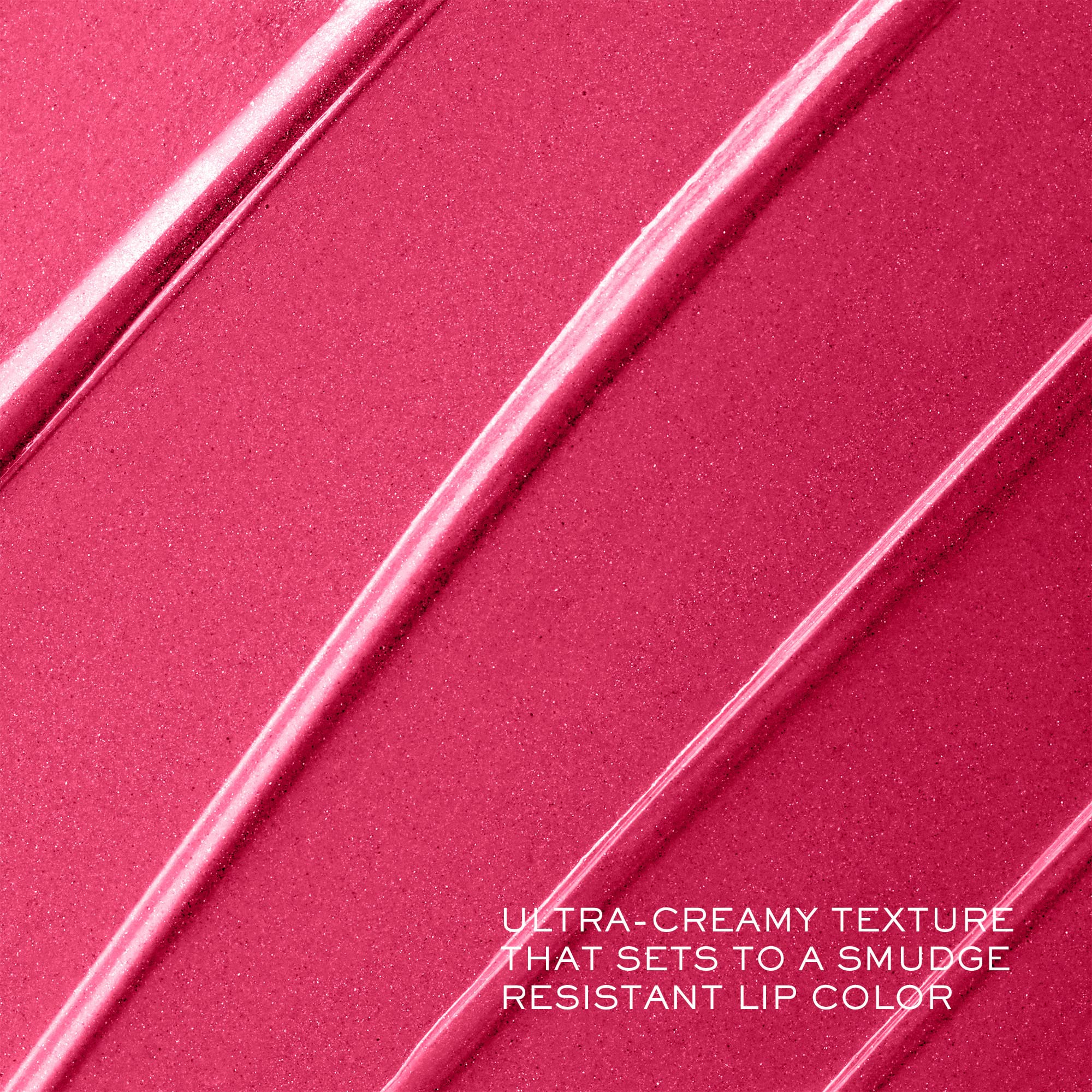 Lancôme lipstick in hand for scale showing compact, travel-ready size