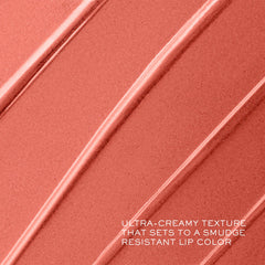 Lancôme lipstick held in hand demonstrating size and real-world scale