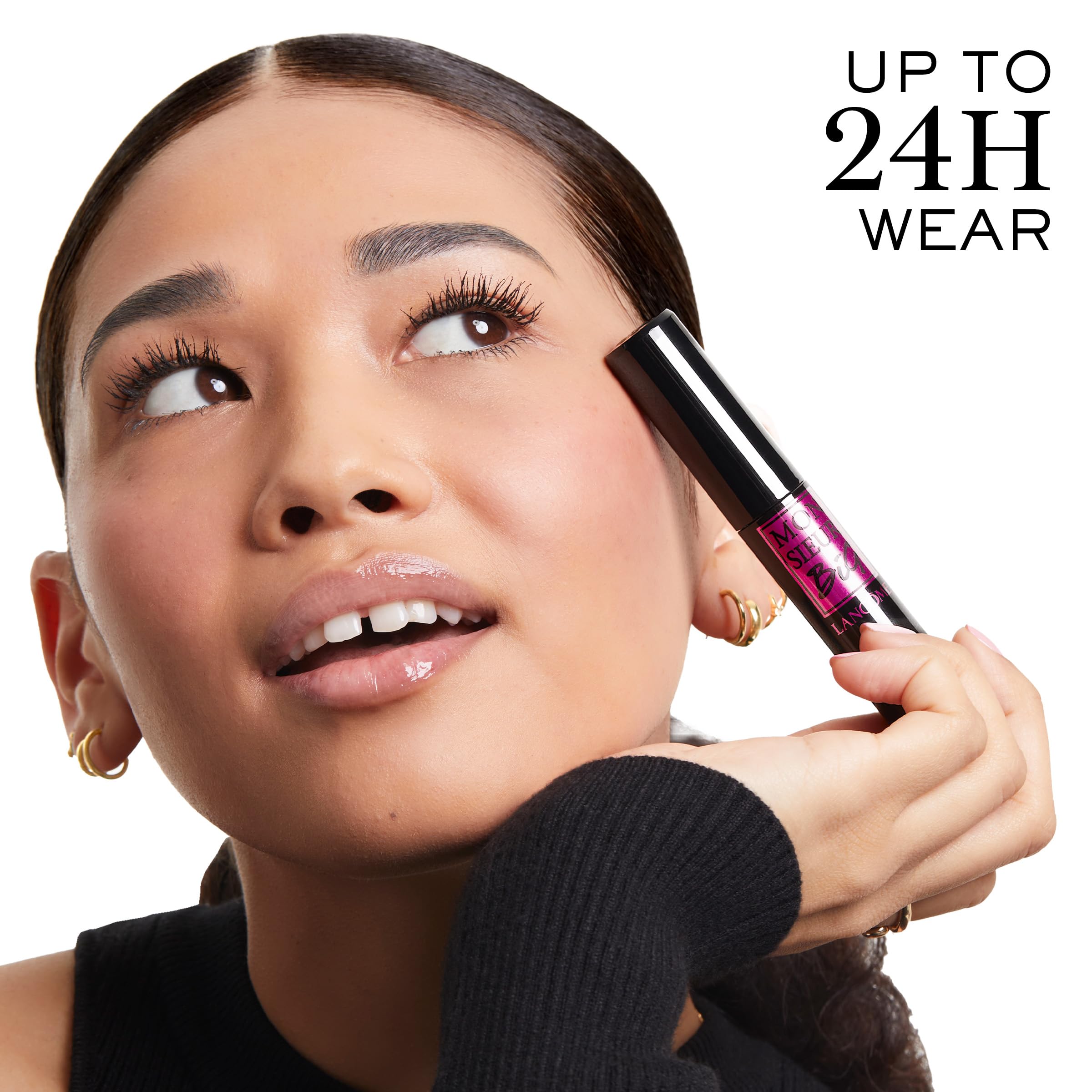 Lancôme shown in hand for scale, illustrating large brush size and ergonomic grip