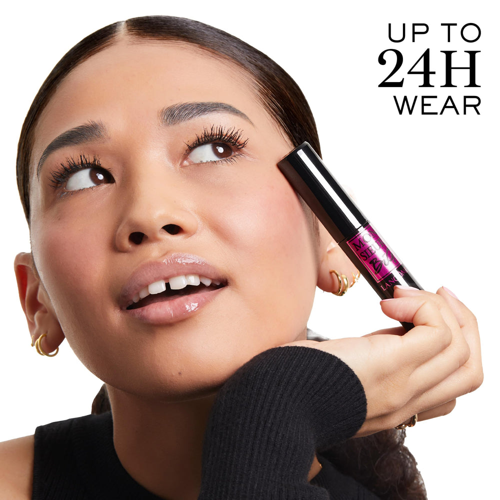 Lancôme shown in hand for scale, illustrating large brush size and ergonomic grip