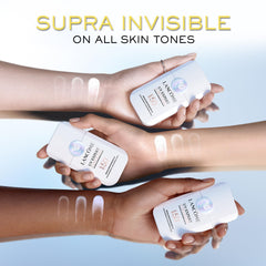 Lancôme size comparison in hand indicating portable everyday sunscreen travel-friendly