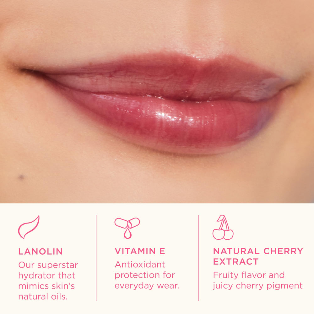 Lanolips cherry swiped on lips demonstrating sheer cherry tint and brighten effect