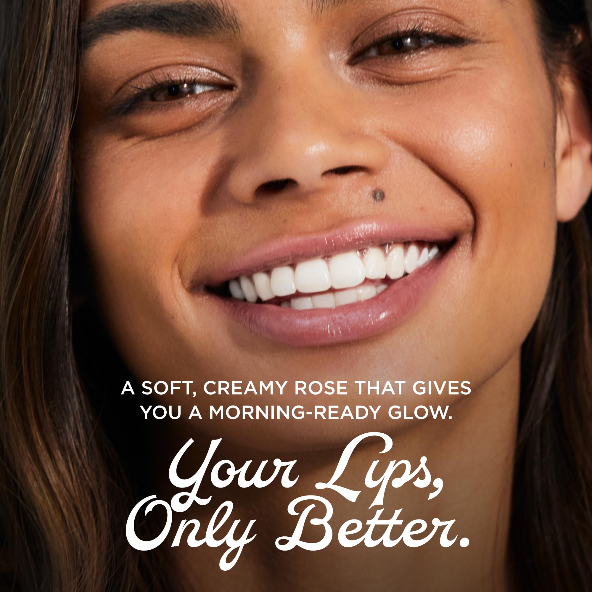 Smiling model wearing Lanolips rose tint illustrating natural color and confident look