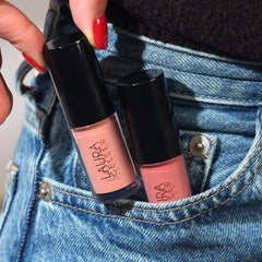 LAURA GELLER NEW YORK product beside common items to show compact travel size