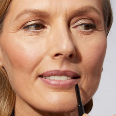 LAURA GELLER NEW YORK creamy texture stroke demonstrating smooth glide and coverage