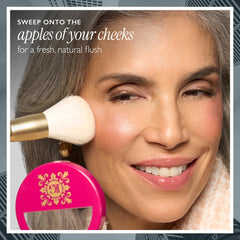 LAURA GELLER NEW YORK brush applying blush for lift and even color