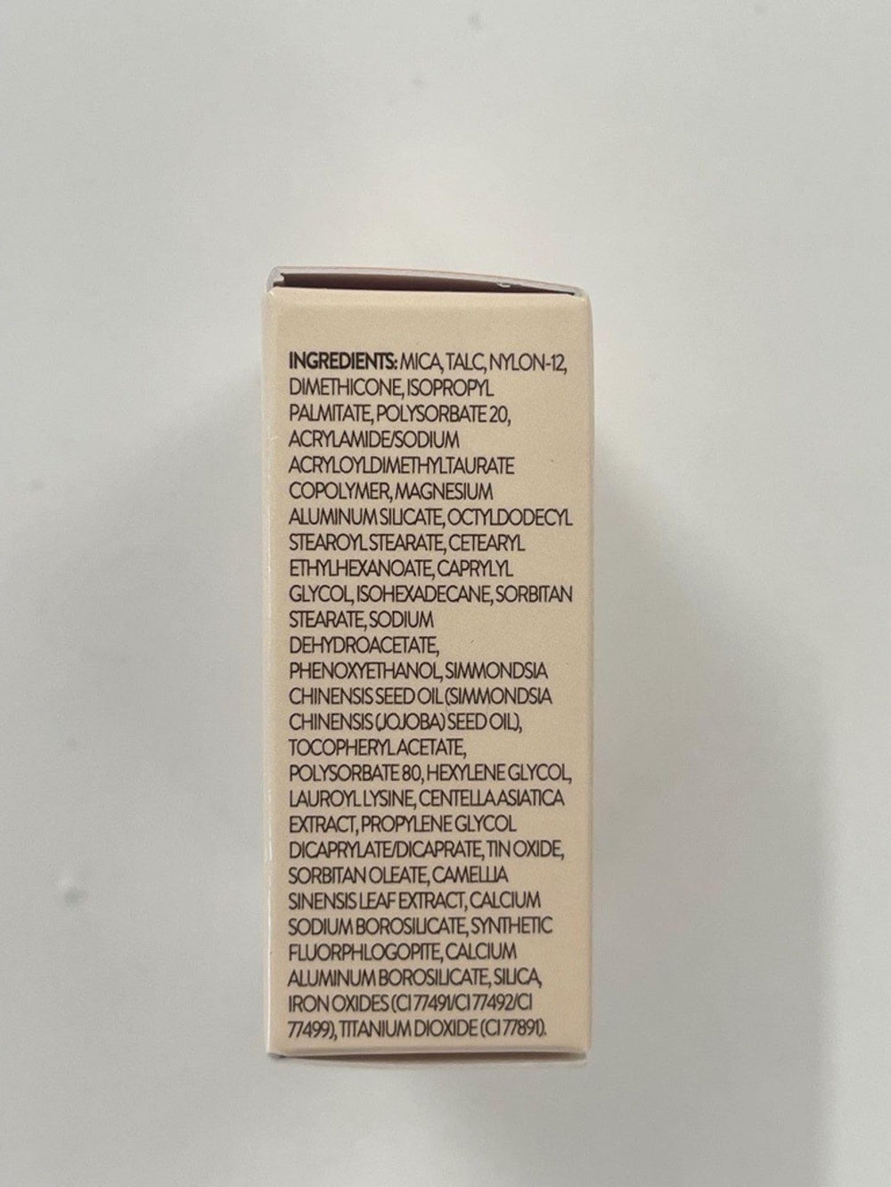 LAURA GELLER NEW YORK highlighter inside makeup bag in lifestyle setting for everyday use