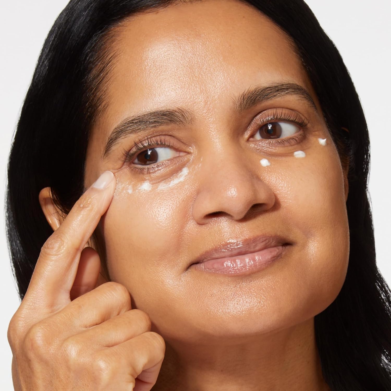 LAURA GELLER Spackle botanical extracts and pearls ingredients display emphasizing hydrating and illuminating benefits