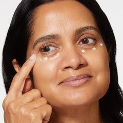 LAURA GELLER Spackle botanical extracts and pearls ingredients display emphasizing hydrating and illuminating benefits