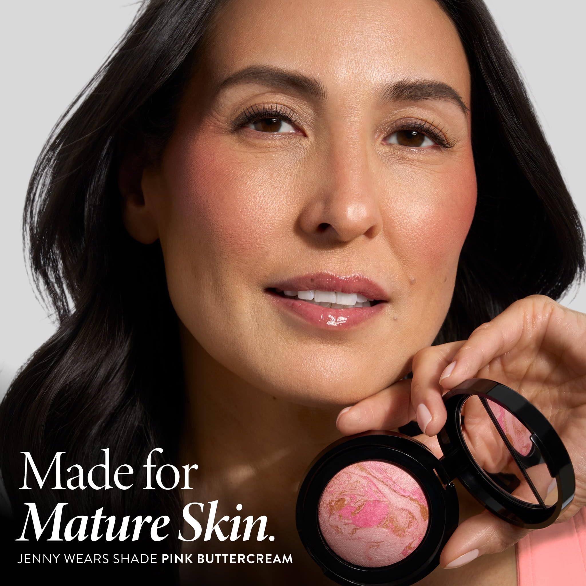 LAURA GELLER swatch of Tropical Peach on forearm showing buildable color