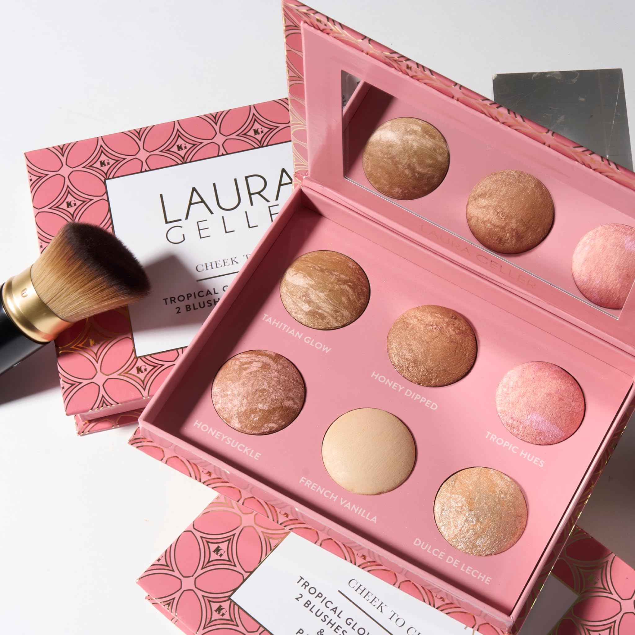 LAURA GELLER palette tucked inside travel bag for on-the-go touch ups