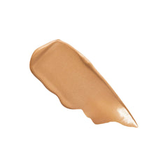 Laura Mercier bottle next to hand showing size and travel-friendly scale