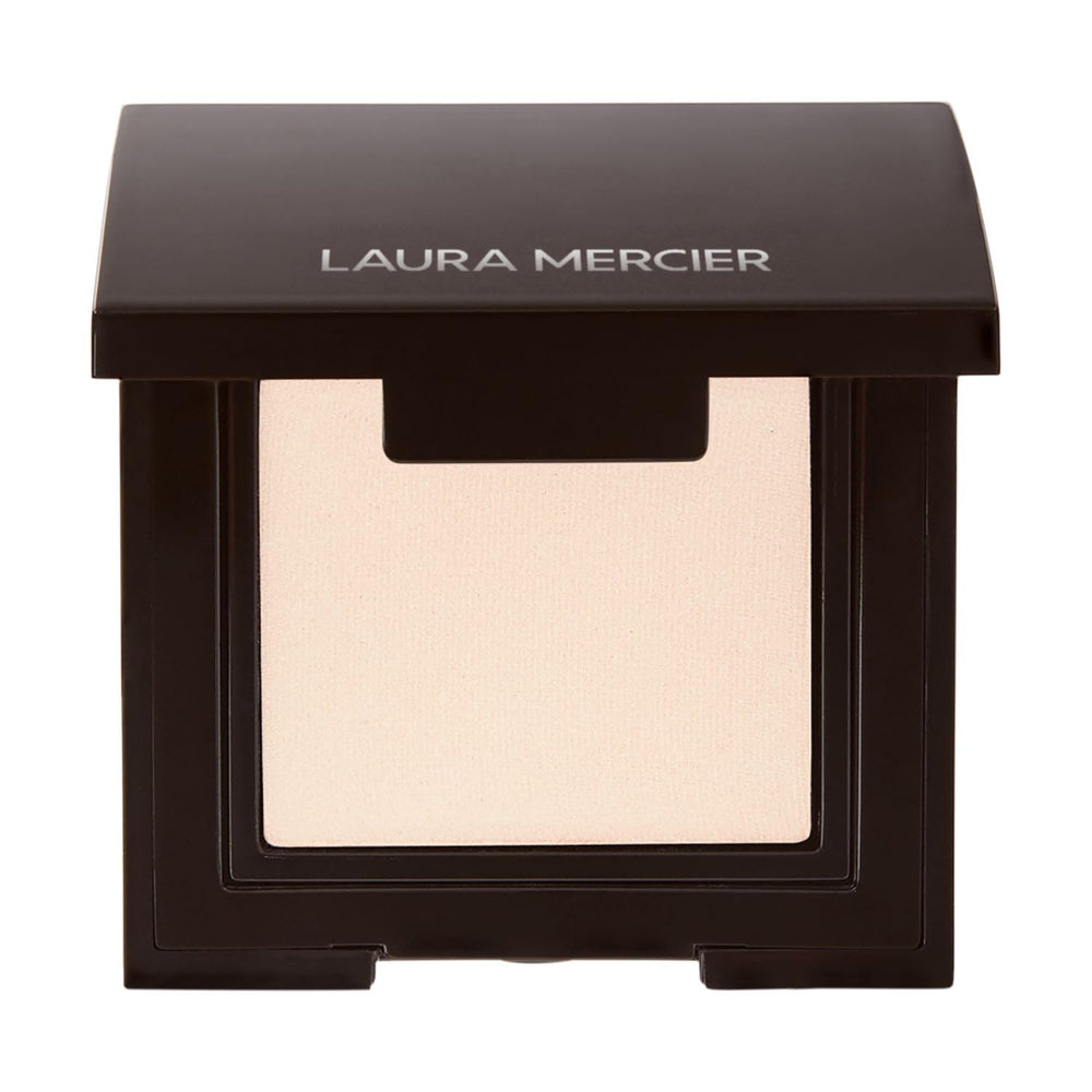 Laura Mercier compact front packaging showing product and label, showcasing premium design and ease of use