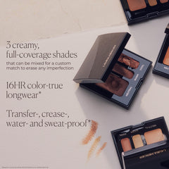 Laura Mercier compact held in hand to show true size and travel convenience