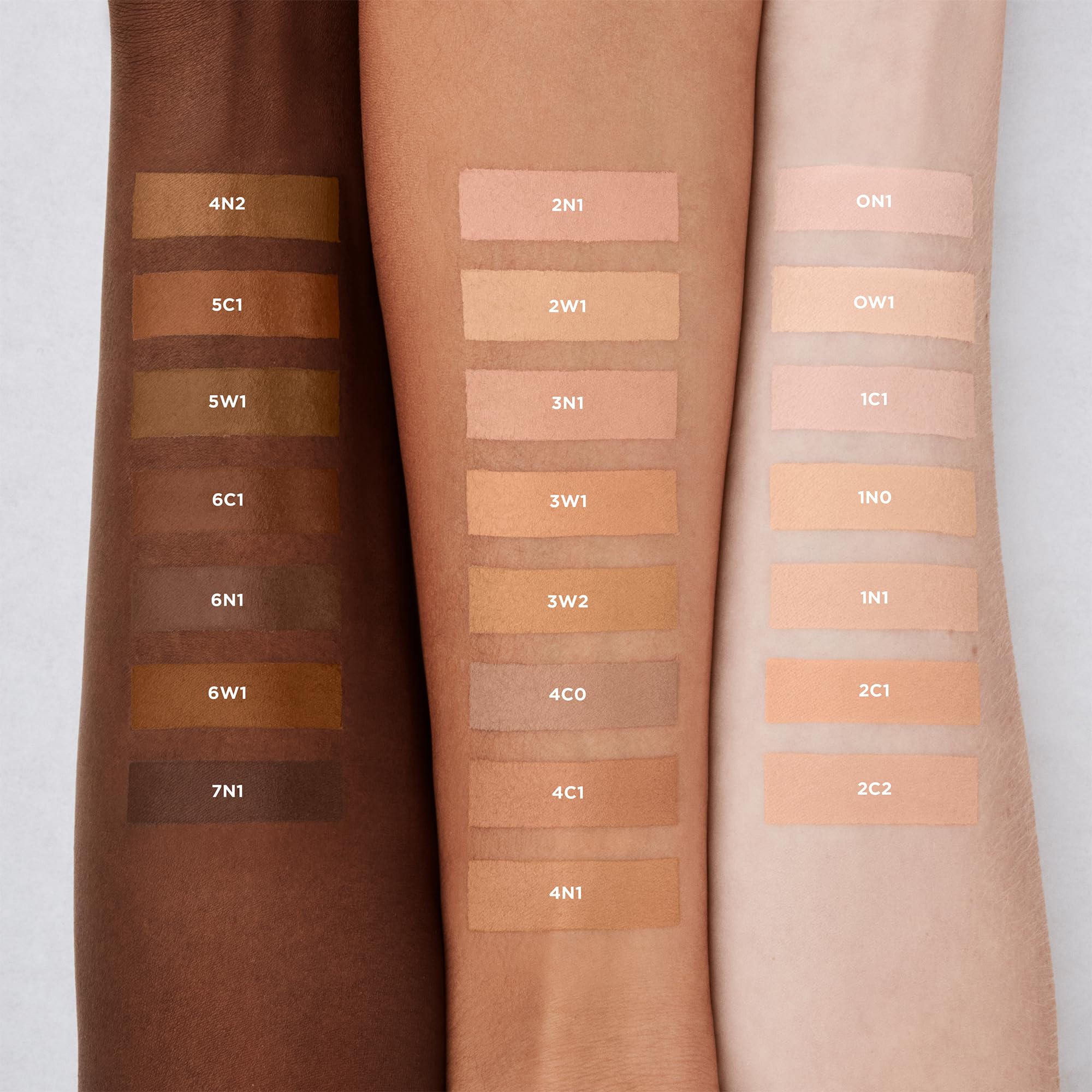 Laura Mercier applicator wand applying concealer showing precise coverage control benefit