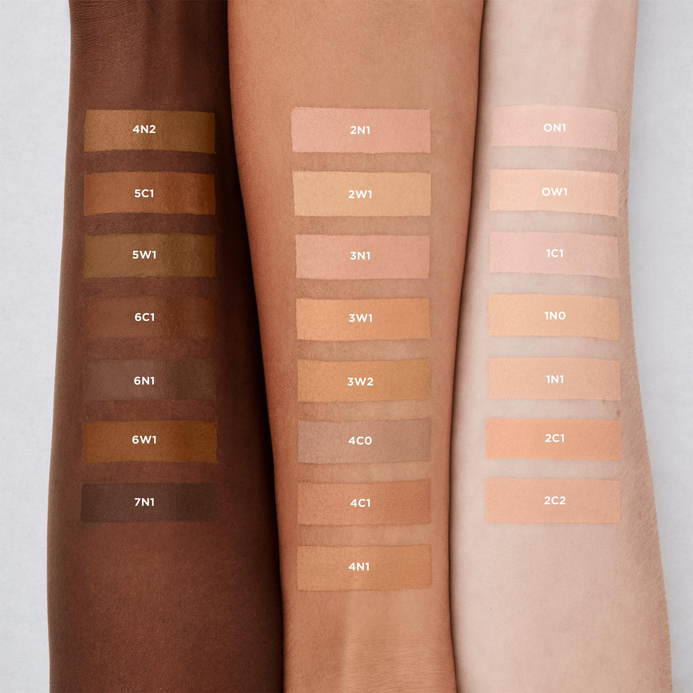 Laura Mercier applicator wand applying concealer showing precise coverage control benefit
