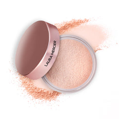 Laura Mercier jar front view showing label and sifter, clear product presentation benefit