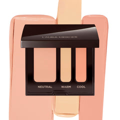 Laura Mercier compact front view showing sleek packaging and portability