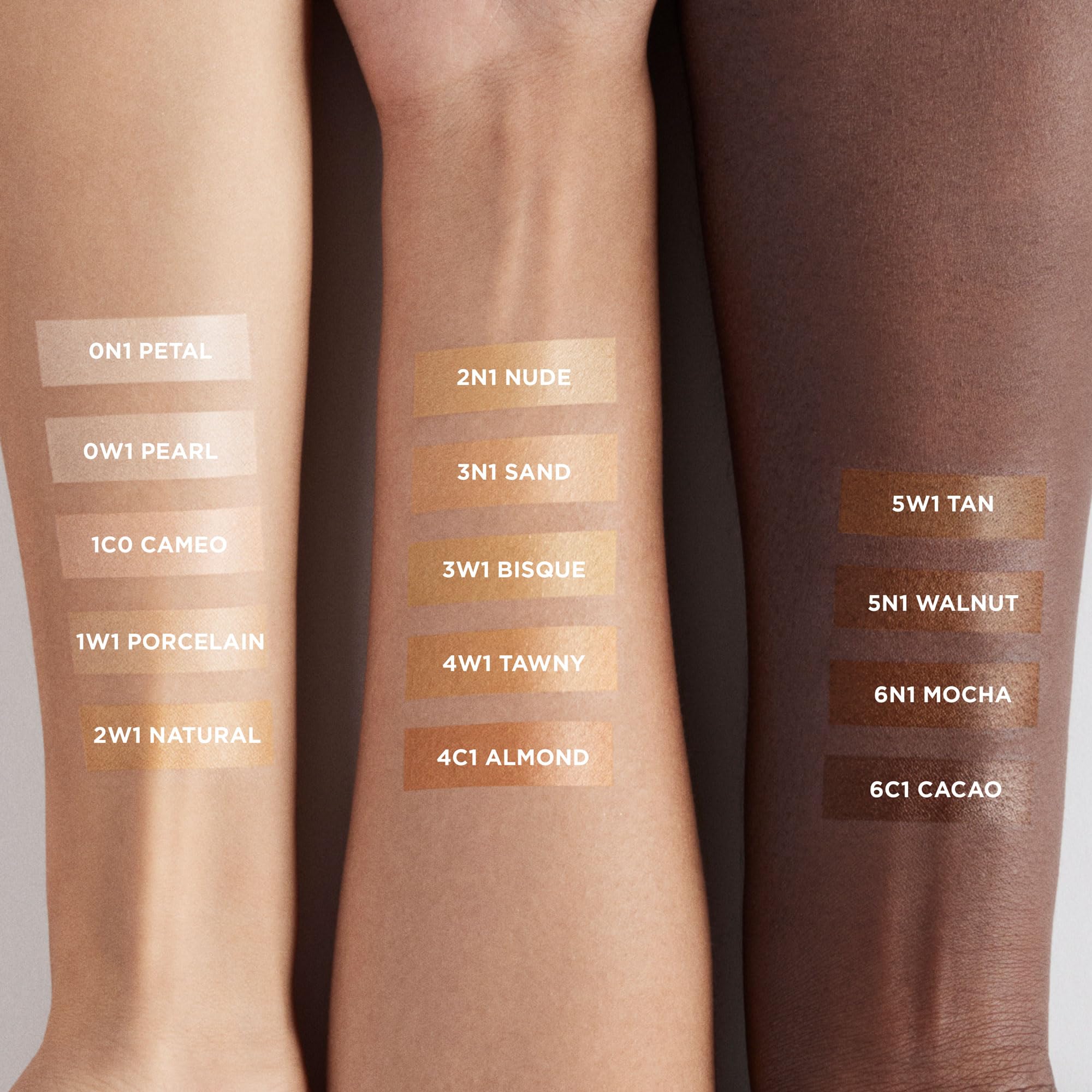 Laura Mercier multiple shade swatches on arm showing sheerness and blendability