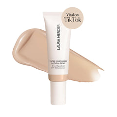 Laura Mercier tube cap detail highlighting secure closure and travel-friendly design