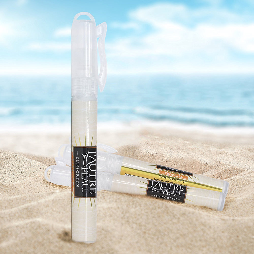 L'AUTRE PEAU pen held in hand showing travel size convenience and easy carry
