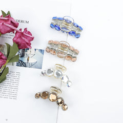 Lawie champagne and coffee clips on low bun, elegant finishing touch