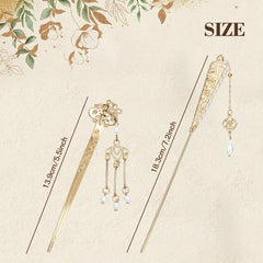 Lawie detail of flower and butterfly pendants offering ornate charm